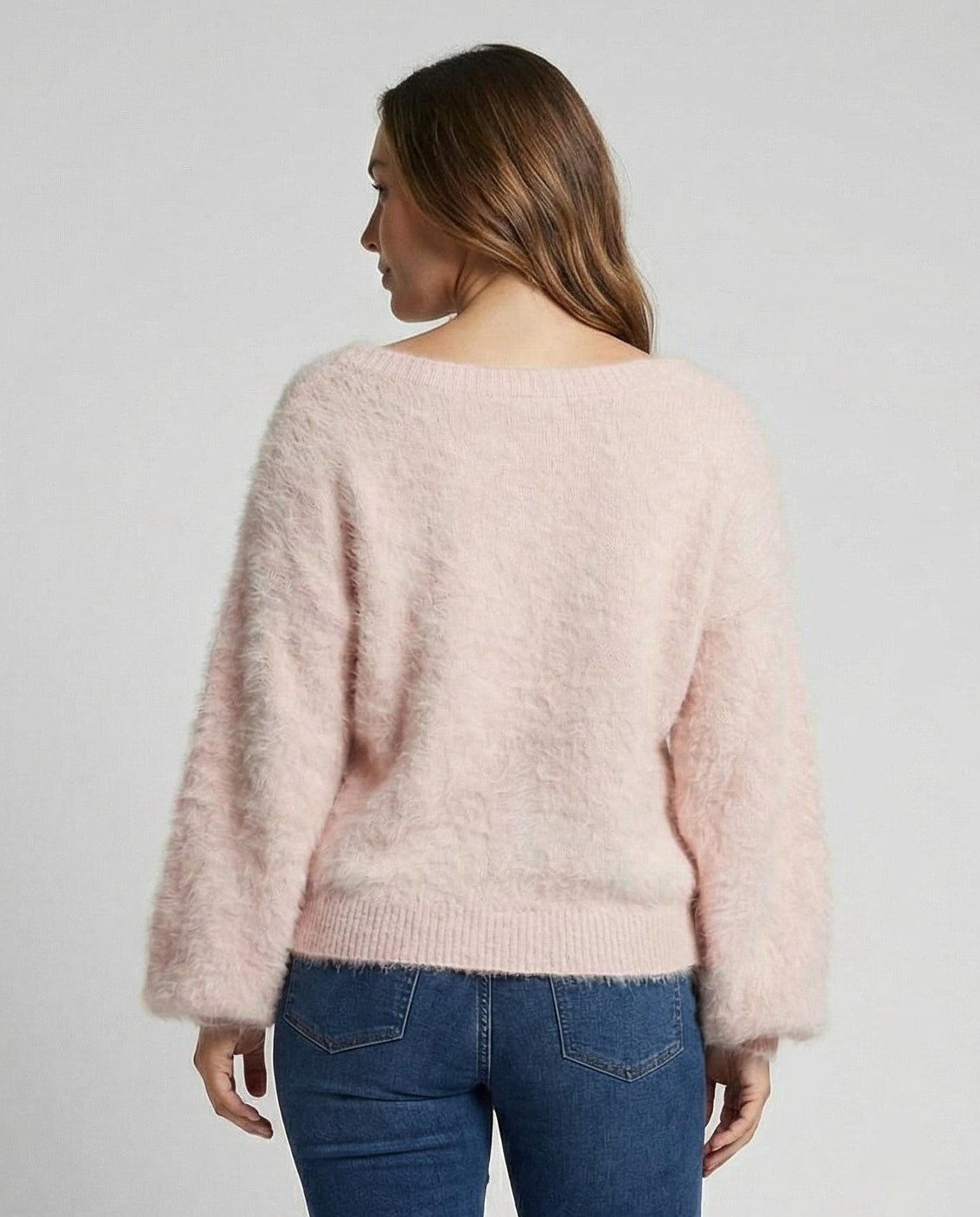 Woman wearing a fuzzy knit oversized sweater
