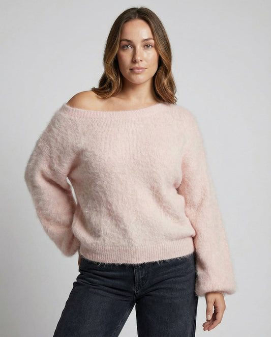 Woman wearing a fuzzy knit oversized sweater