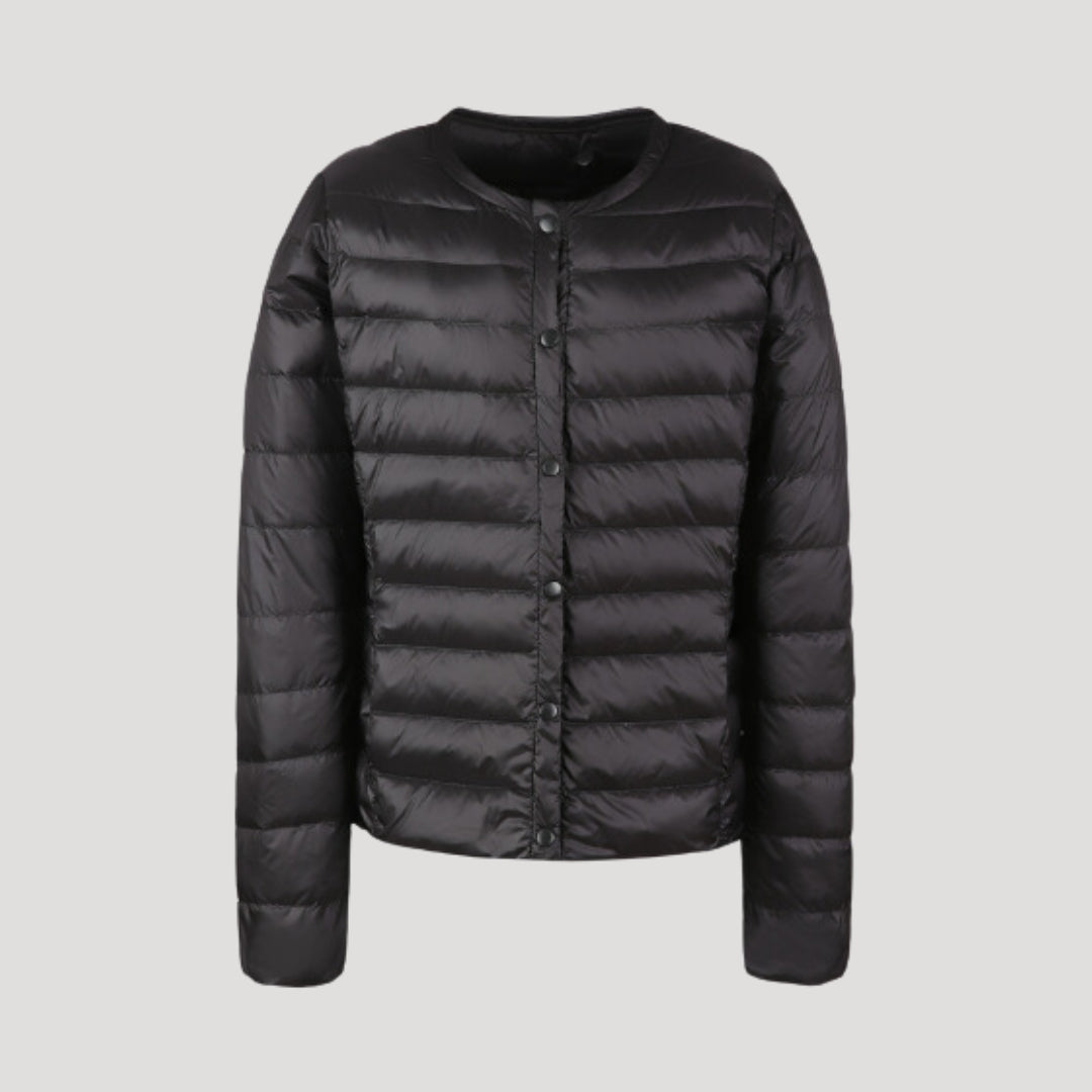Woman wearing a lightweight collarless quilted puffer jacket