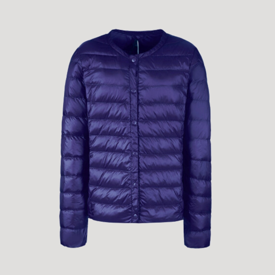 Woman wearing a lightweight collarless quilted puffer jacket