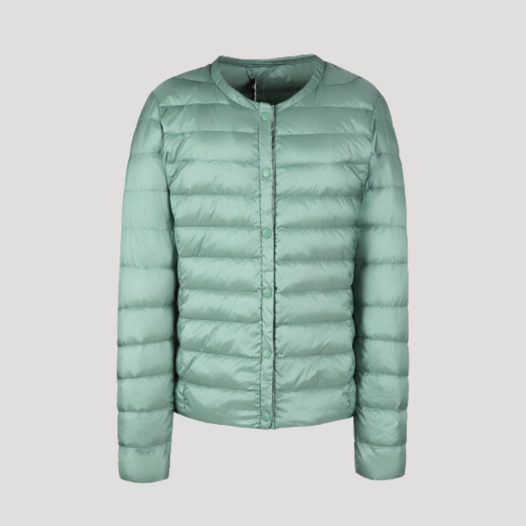 Woman wearing a lightweight collarless quilted puffer jacket
