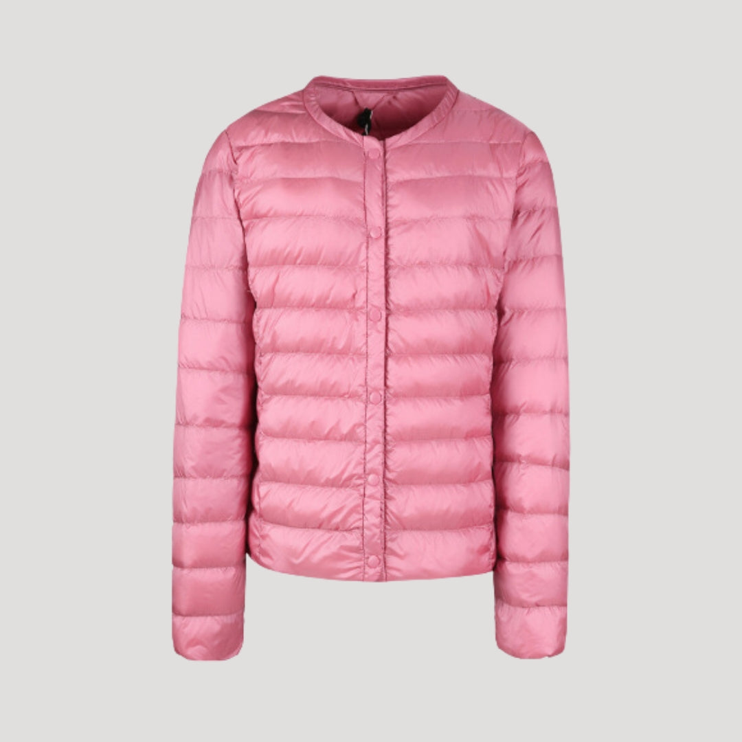 Woman wearing a lightweight collarless quilted puffer jacket