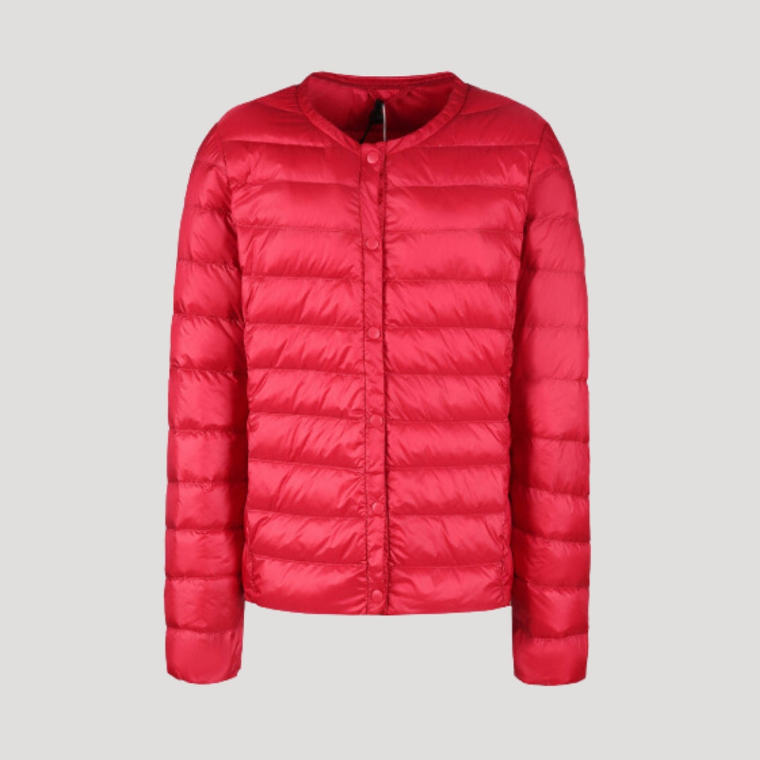 Woman wearing a lightweight collarless quilted puffer jacket