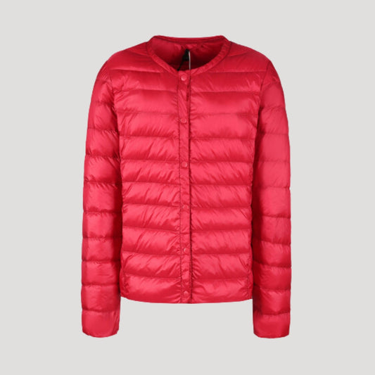 Woman wearing a lightweight collarless quilted puffer jacket