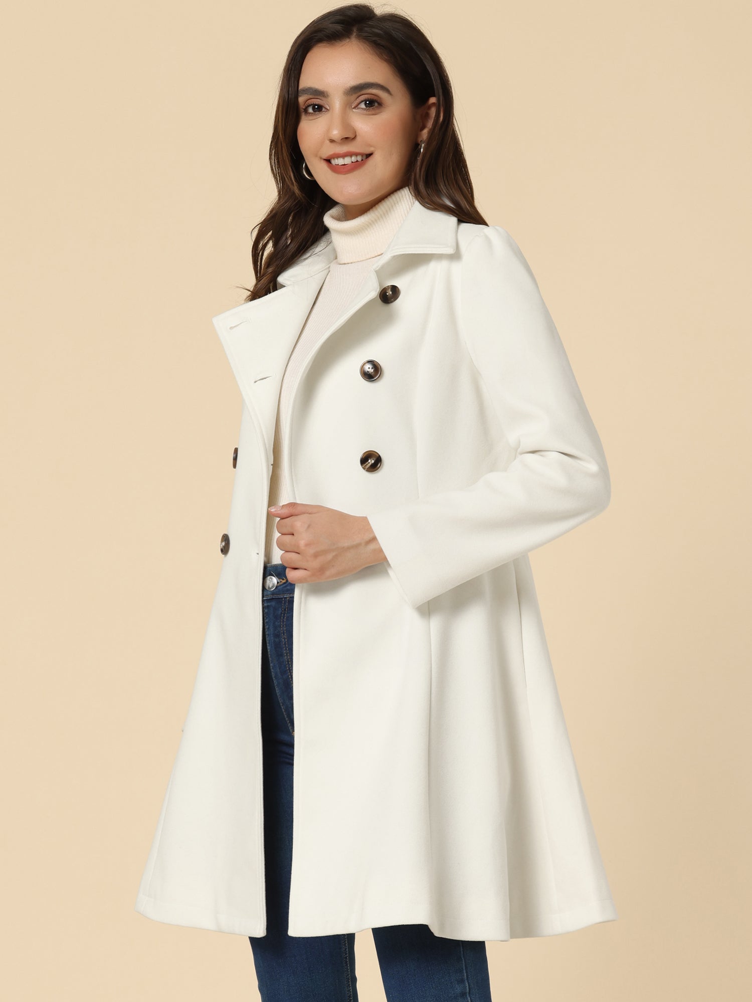 Woman wearing a double-breasted flared mid-length trench coat with notched collar