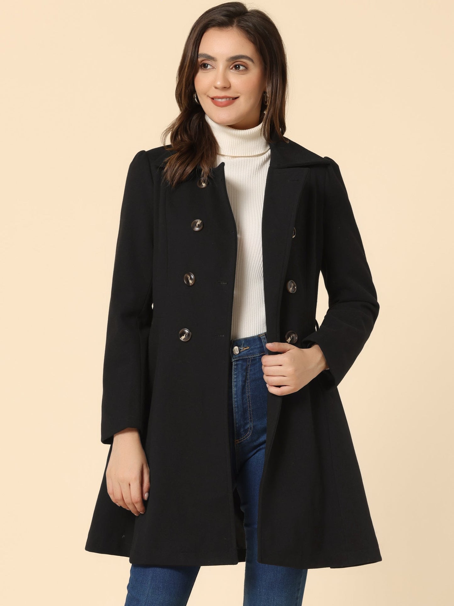 Woman wearing a double-breasted flared mid-length trench coat with notched collar