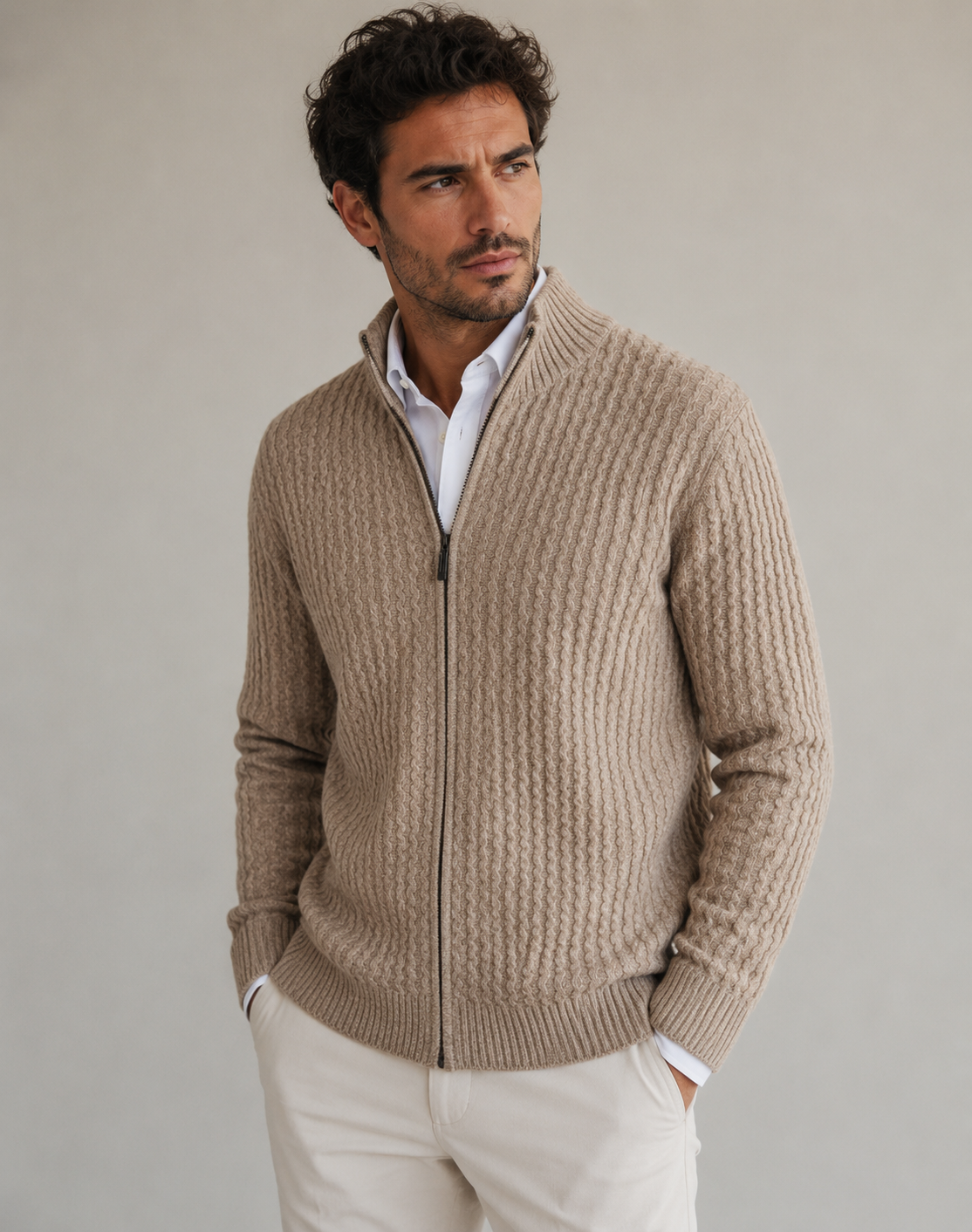 Man wearing a full zip textured knit sweater with stand-up collar