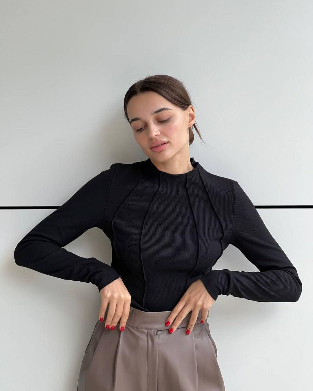Woman wearing a basic long sleeve round neck top