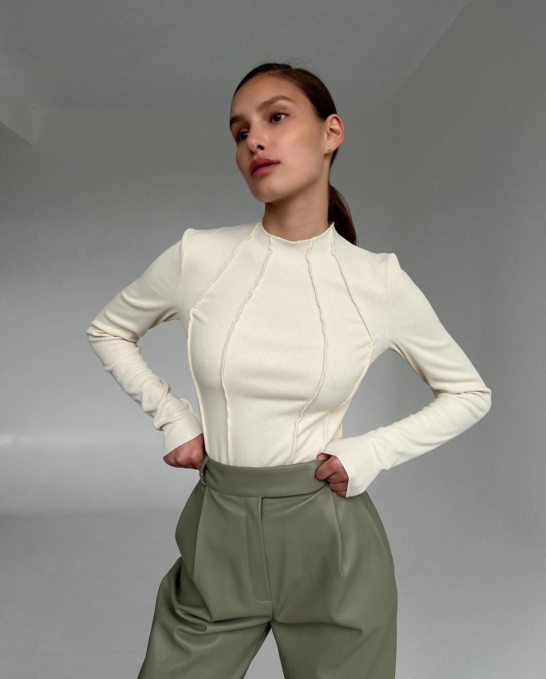 Woman wearing a basic long sleeve round neck top