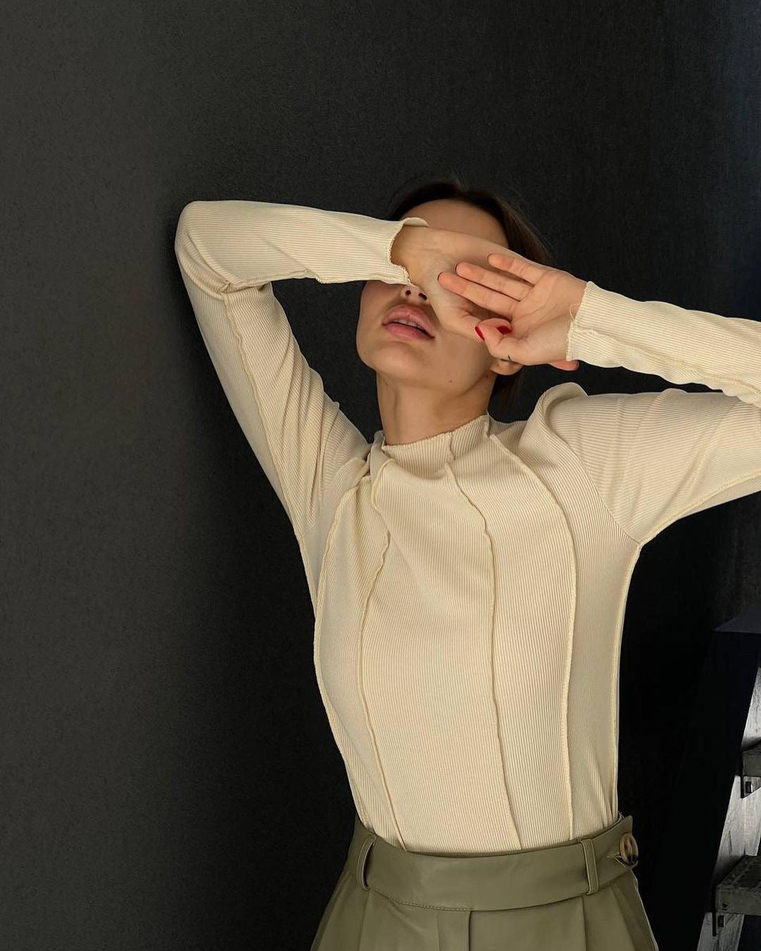 Woman wearing a basic long sleeve round neck top
