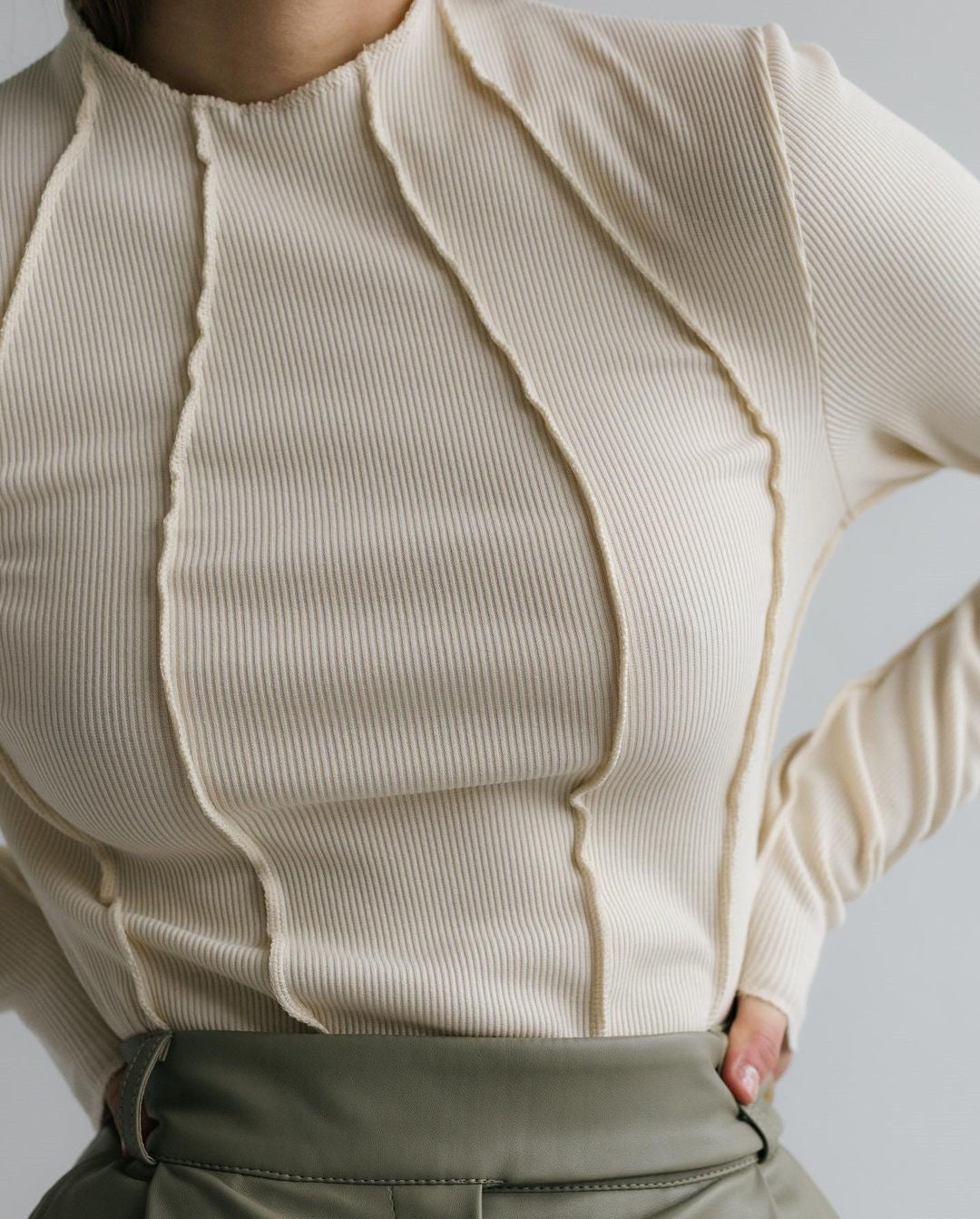 Woman wearing a basic long sleeve round neck top