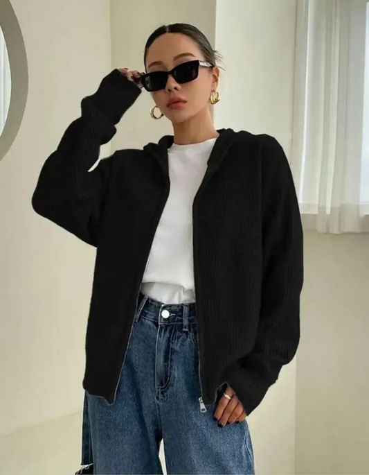 Woman wearing a zip up hooded cardigan