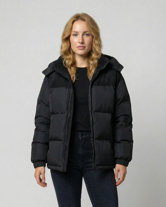 Woman wearing a hooded insulated quilted puffer jacket