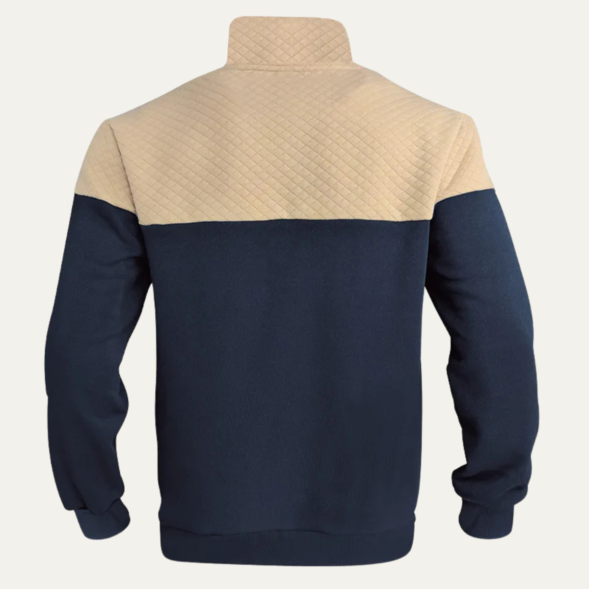 Man wearing a quilted color block half zip sweater