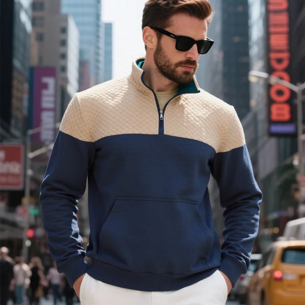 Man wearing a quilted color block half zip sweater