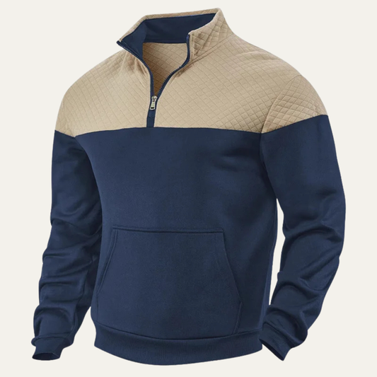 Man wearing a quilted color block half zip sweater