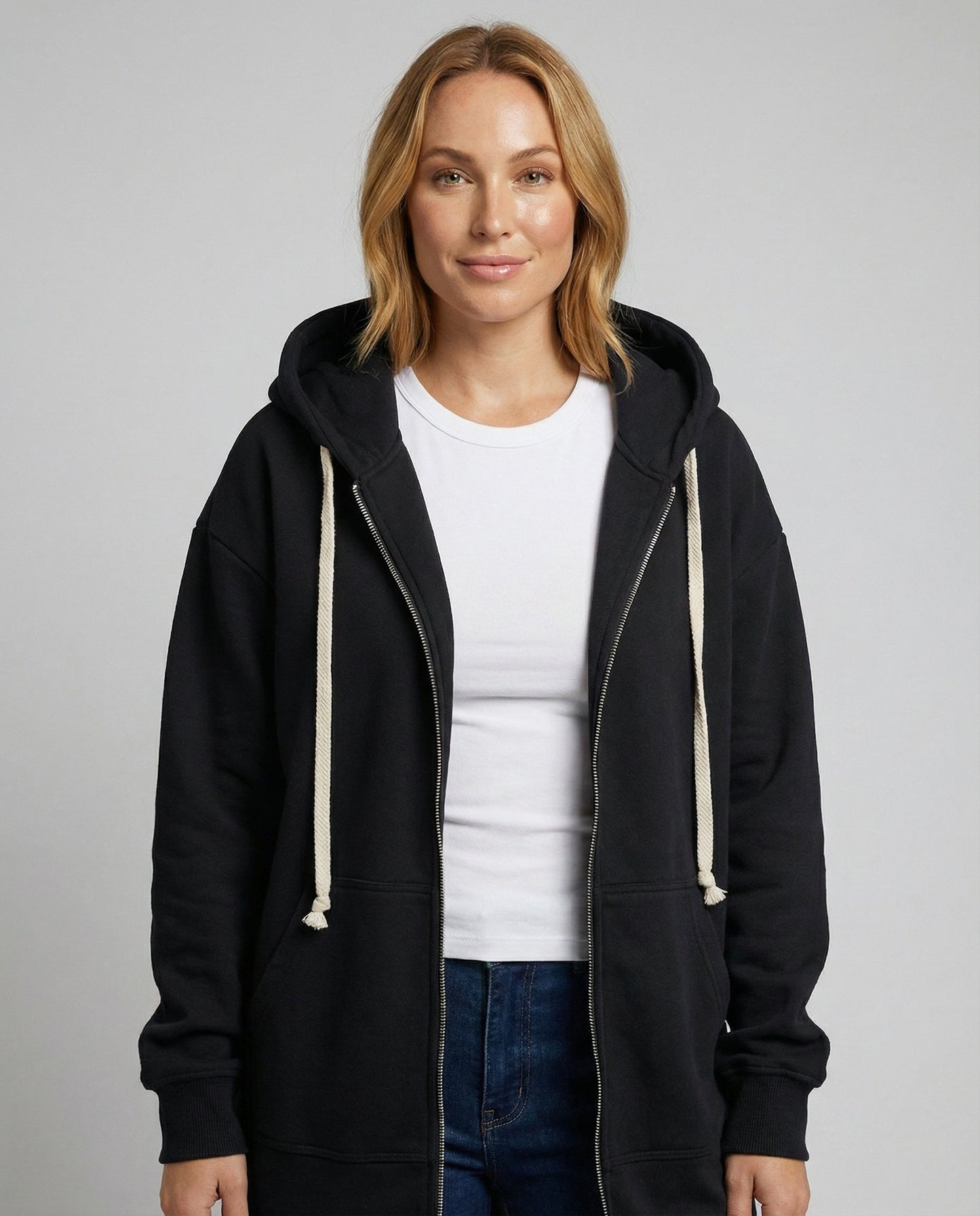 Woman wearing a knee length hooded sweatshirt