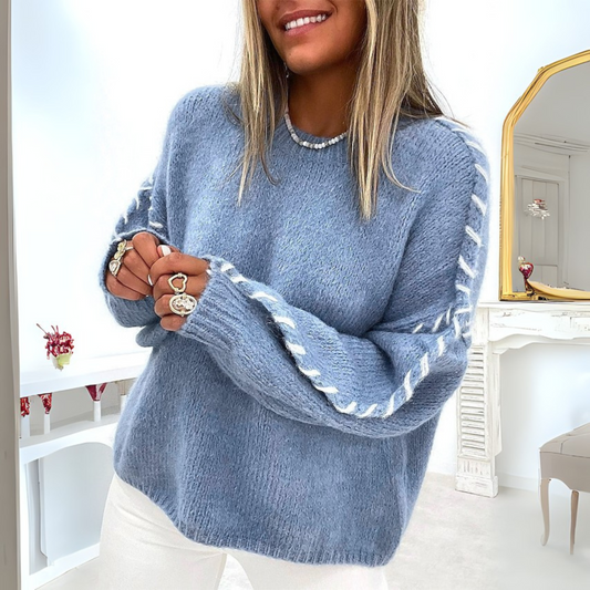 Woman wearing a distressed oversized crew sweater