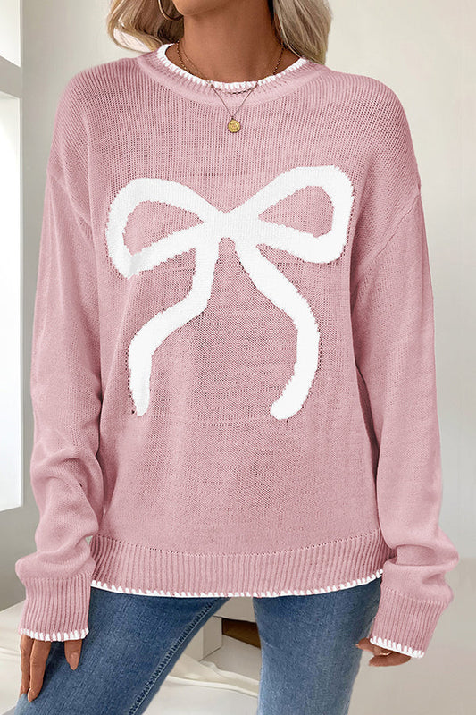 Woman wearing a cozy bow knit Christmas sweater