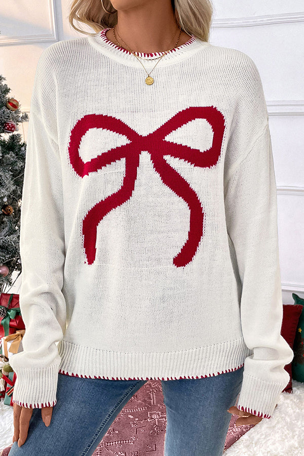Woman wearing a cozy bow knit Christmas sweater