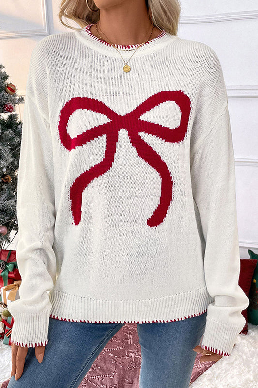 Woman wearing a cozy bow knit Christmas sweater