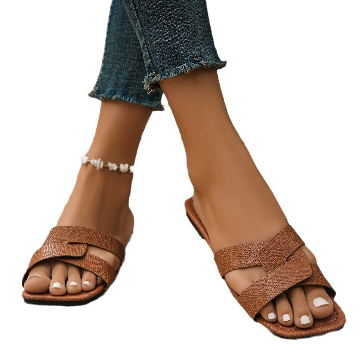 Women's crossed-strap flat slides