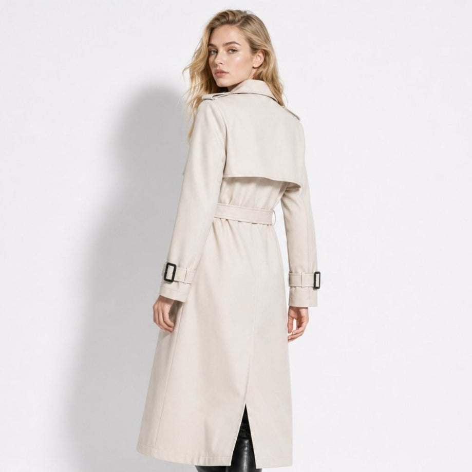 Woman wearing a long double-breasted belted trench coat