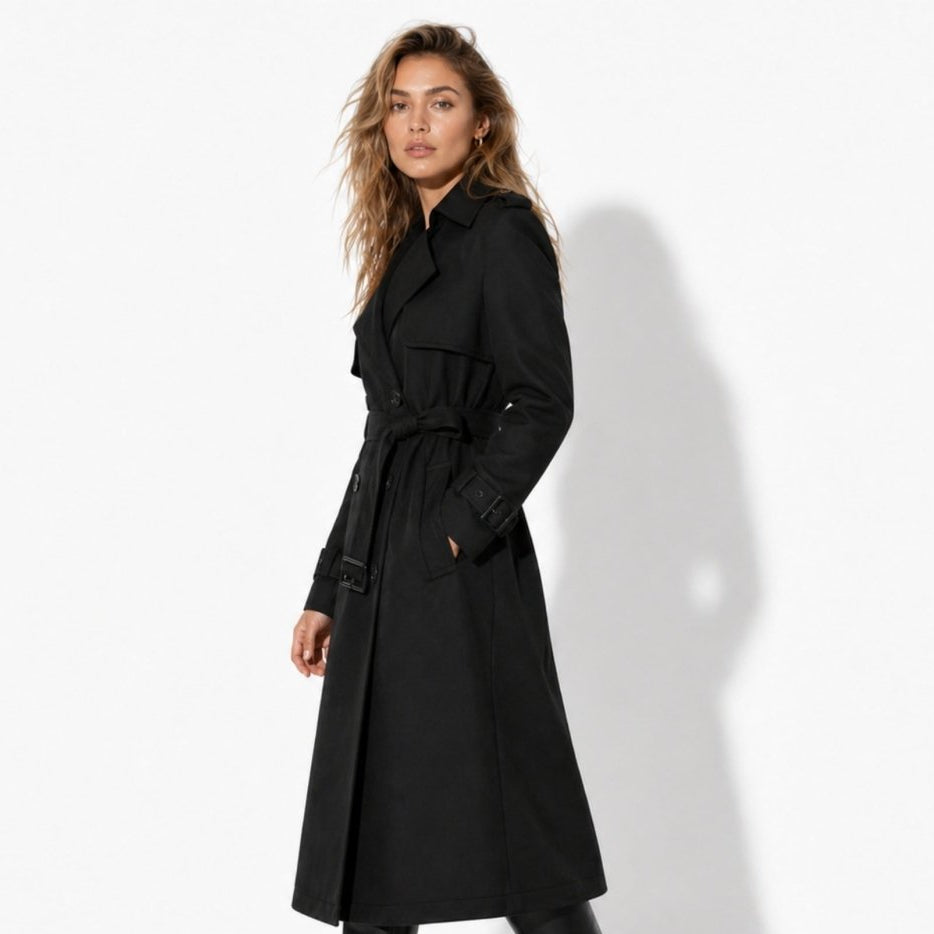 Woman wearing a long double-breasted belted trench coat
