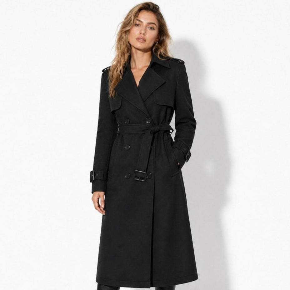 Woman wearing a long double-breasted belted trench coat
