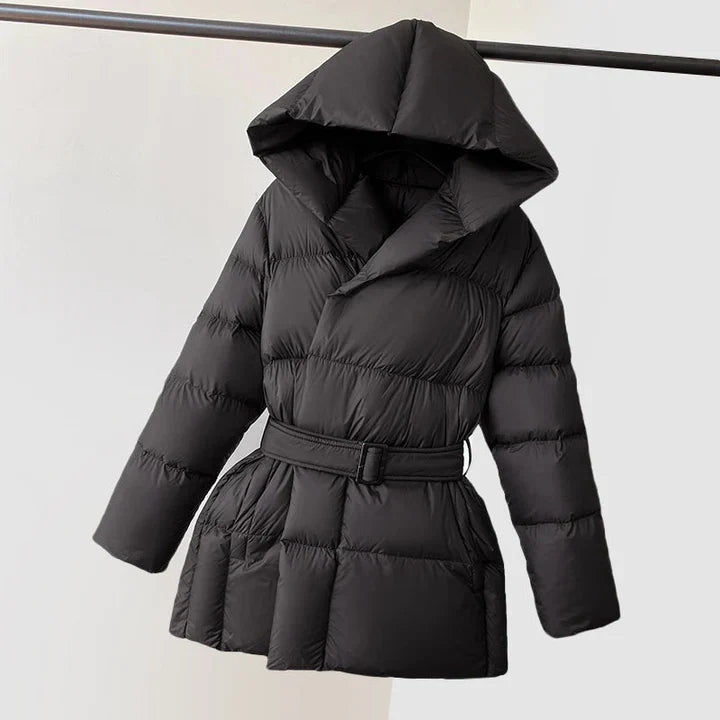 Woman wearing a belted hooded quilted puffer jacket