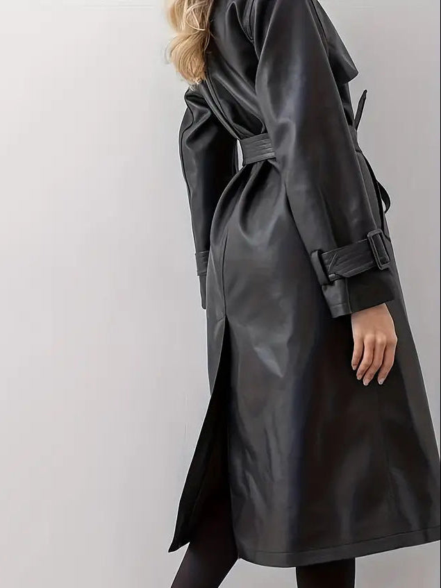 Woman wearing a faux leather trench coat