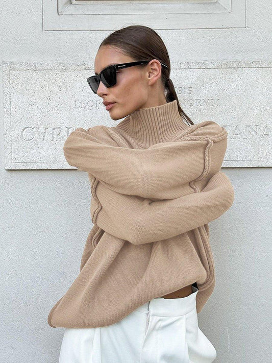Woman wearing a textured oversized turtleneck sweater