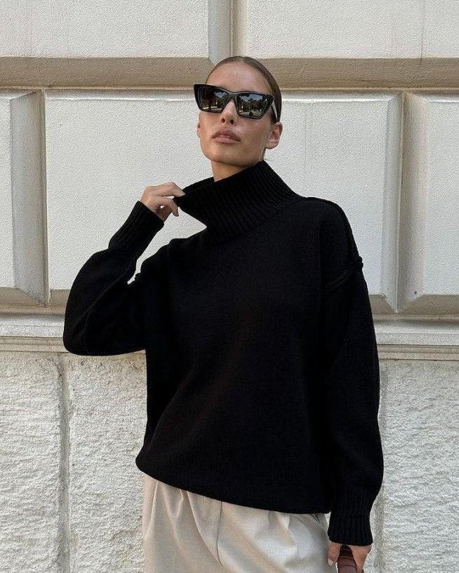Woman wearing a textured oversized turtleneck sweater