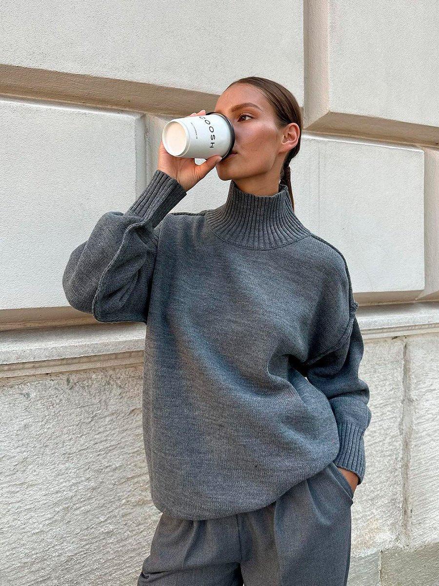 Woman wearing a textured oversized turtleneck sweater