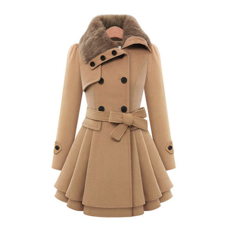 Woman wearing a double-breasted coat with a plush faux fur collar
