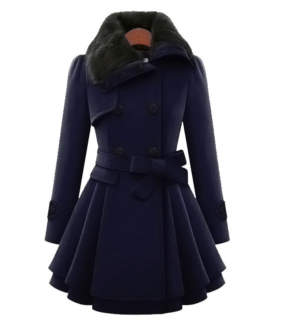 Woman wearing a double-breasted coat with a plush faux fur collar