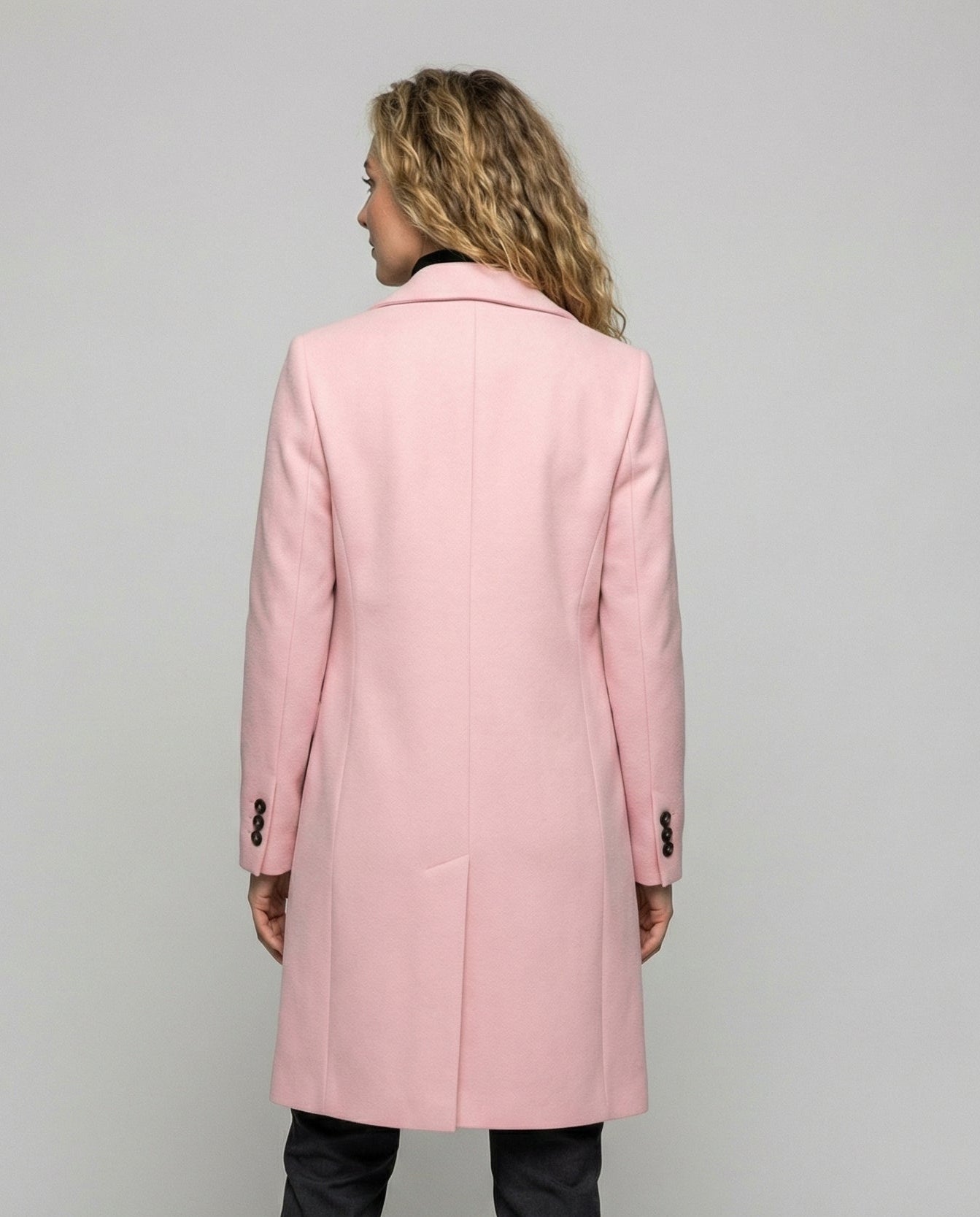 Woman wearing a warm belted trench coat