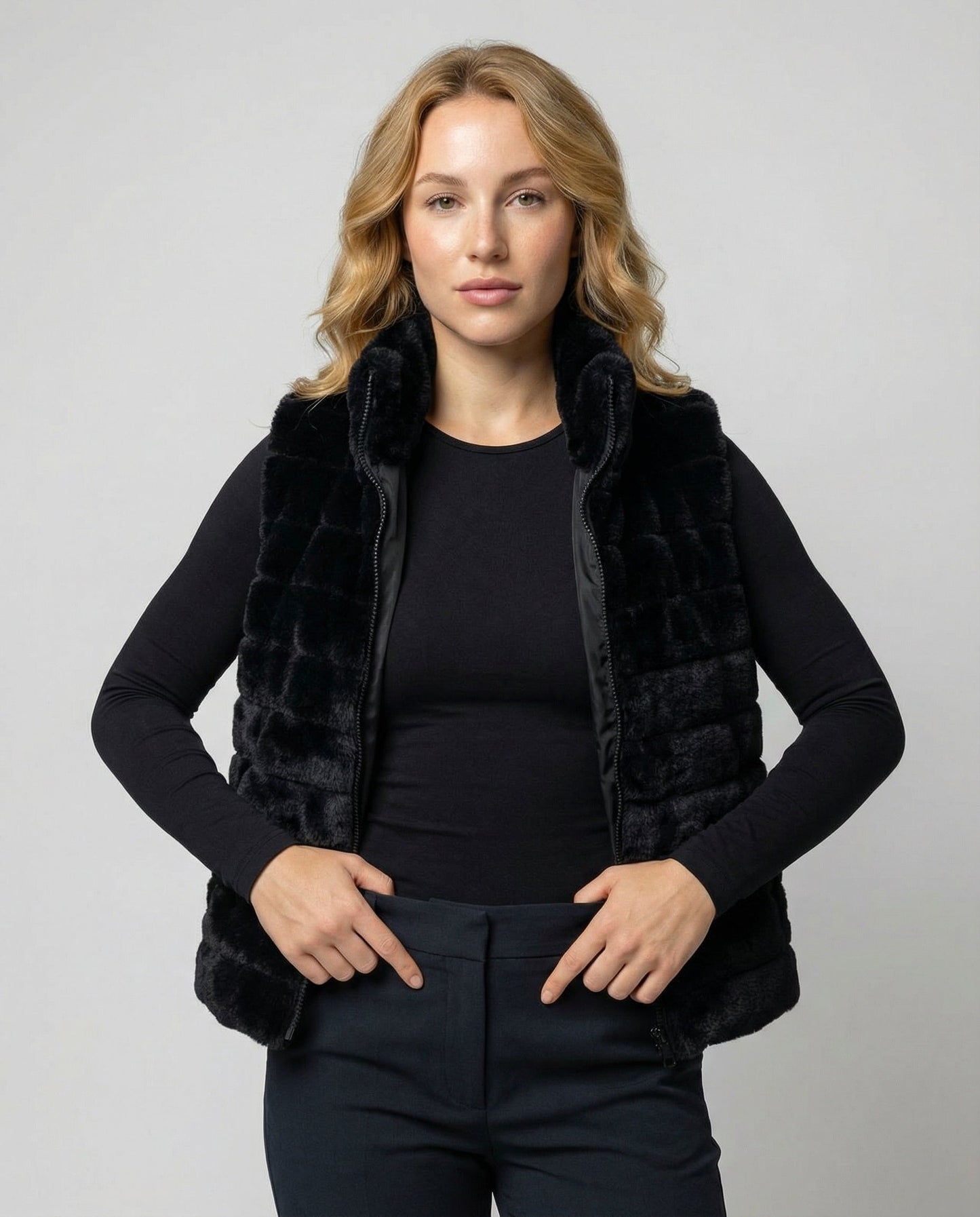 Woman wearing a faux fur quilted vest