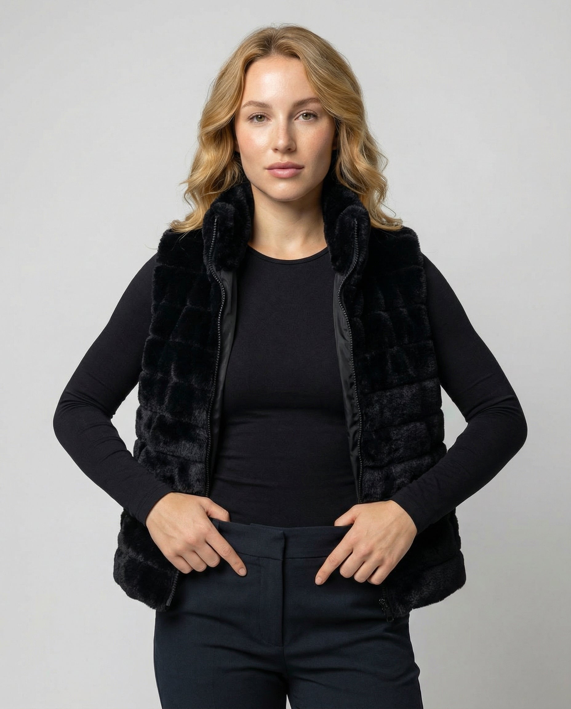 Woman wearing a faux fur quilted vest