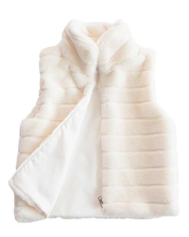 Woman wearing a faux fur quilted vest