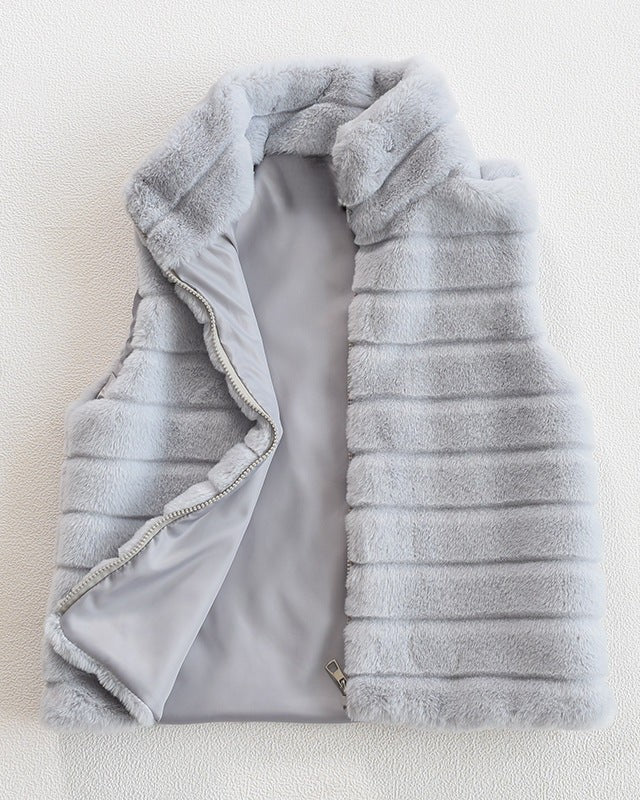 Woman wearing a faux fur quilted vest