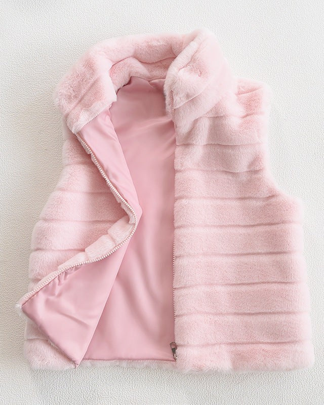 Woman wearing a faux fur quilted vest