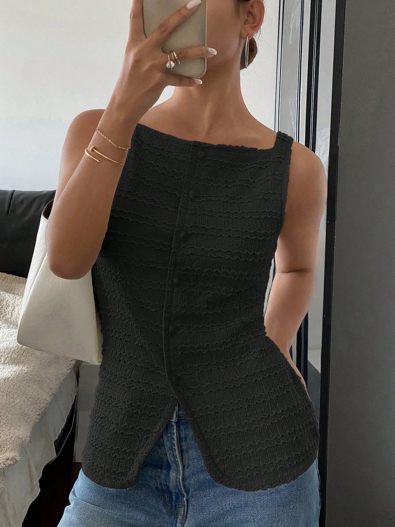 Black button front vest for women.