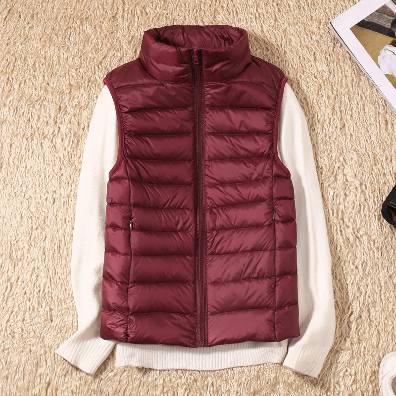 Burgundy lightweight quilted vest for women.