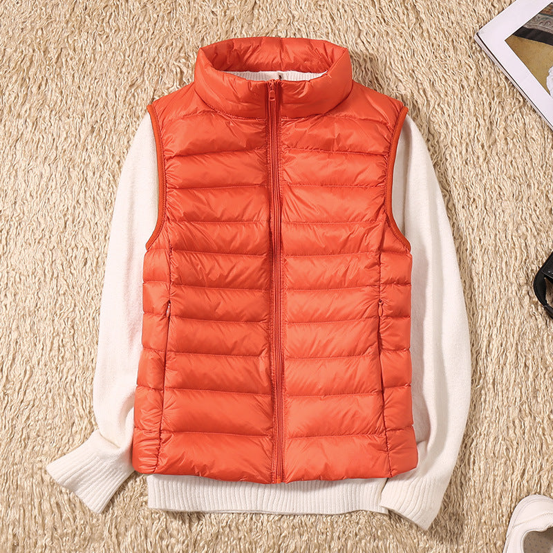 Orange lightweight quilted vest for women.