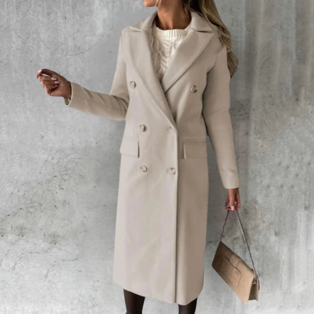 Woman wearing a longline double-breasted overcoat with notched lapel