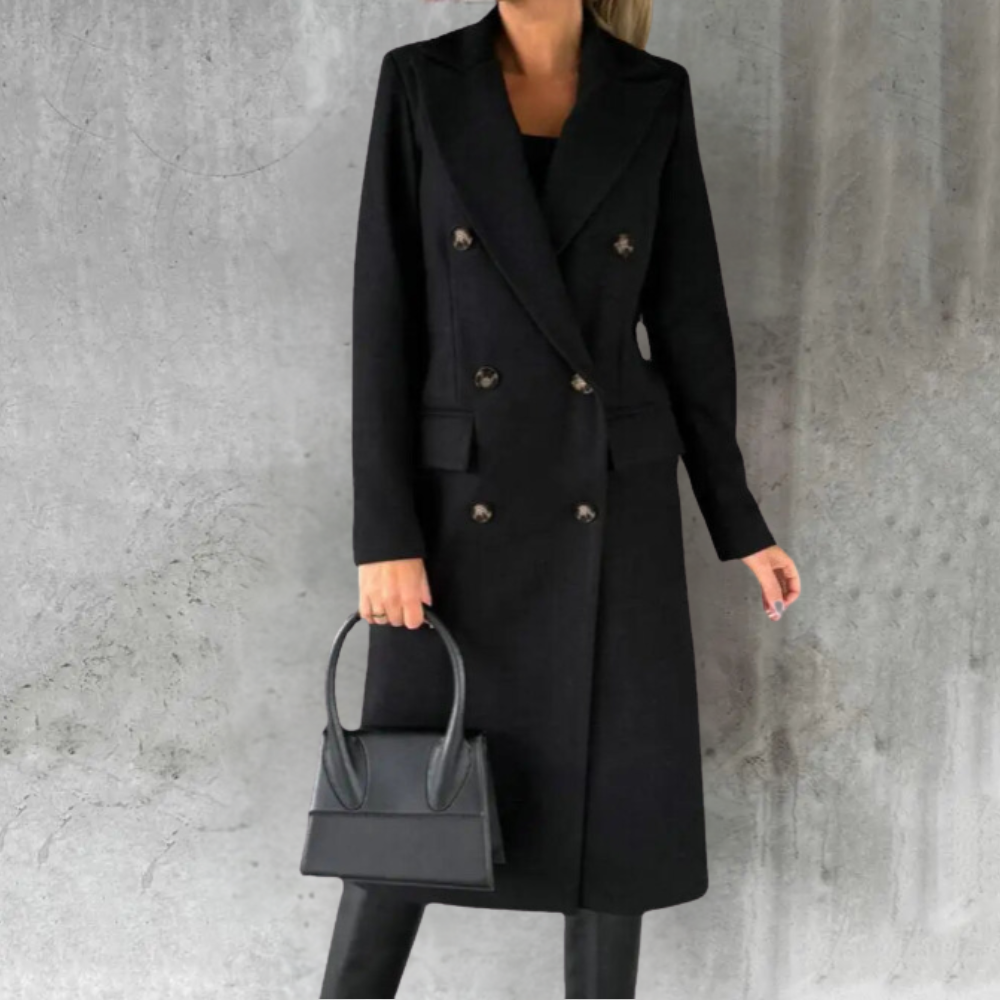Woman wearing a longline double-breasted overcoat with notched lapel