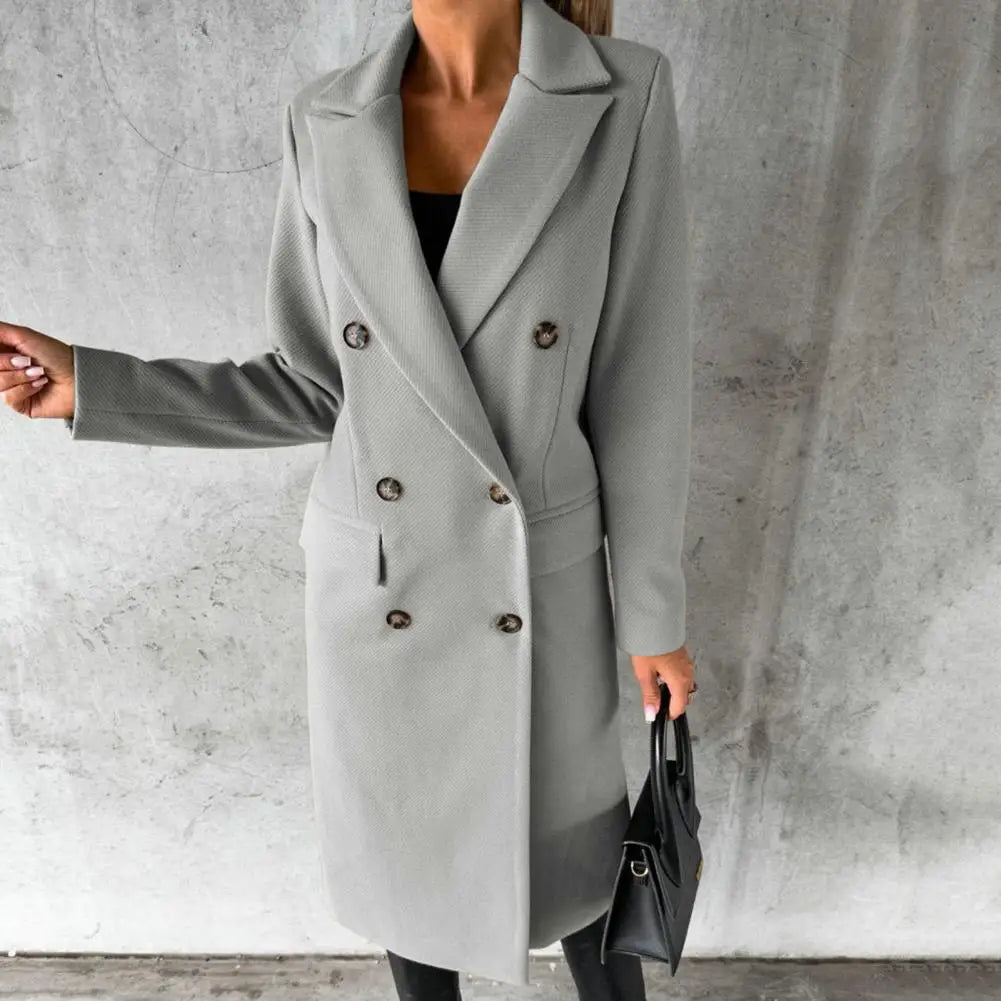 Woman wearing a longline double-breasted overcoat with notched lapel