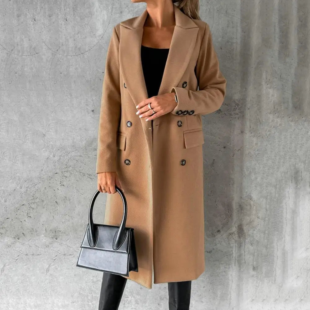 Woman wearing a longline double-breasted overcoat with notched lapel