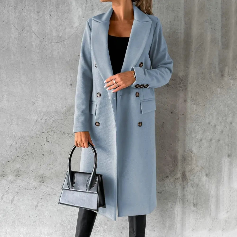 Woman wearing a longline double-breasted overcoat with notched lapel